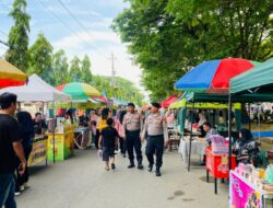 Personel Sat Pamobvit Beri Pengamanan di Festival Ahad UMKM Kota Lhokseumawe Guna Cegah Guantibmas