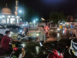 Genangan Air Akibat Hujan Deras, Polsek Muara Satu Sigap Atur Arus Lalin di Jalur Padat Medan–Banda Aceh