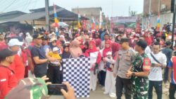Polsek Muara Batu Amankan Gerak Jalan Sehat HUT ke-80 RI