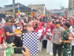 Polsek Muara Batu Amankan Gerak Jalan Sehat HUT ke-80 RI