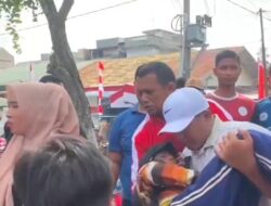 Aksi Kapolres Lhokseumawe Gendong Anak Pingsan ke Ambulans Saat Jalan Santai HUT ke-80 RI