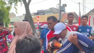 Aksi Kapolres Lhokseumawe Gendong Anak Pingsan ke Ambulans Saat Jalan Santai HUT ke-80 RI