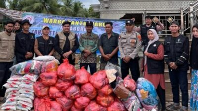 Polsek Muara Batu Kawal Penyaluran Bantuan Banjir YBHA dan HMI untuk Warga Paloh Raya